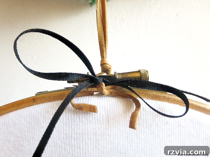 Upcycled T-shirt Wall Decor 8 Cord and ribbon thoughtfully added to the top of the embroidery hoop, creating a ready-to-hang feature for the upcycled t-shirt art.
