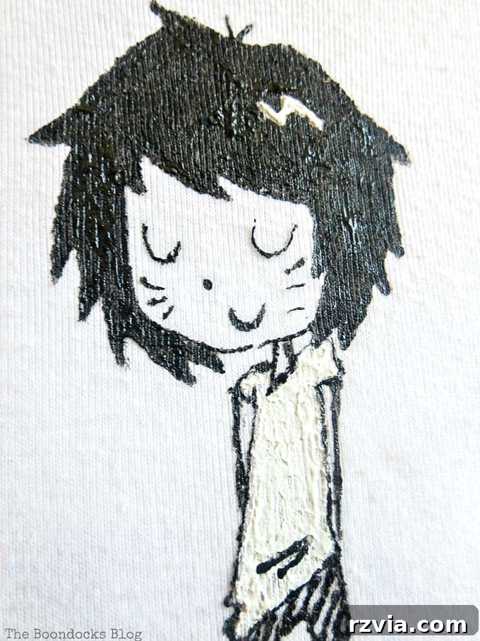 Upcycled T-shirt Wall Decor 10 Close up of the charming girl character drawing on a white tshirt, now framed as unique wall art.