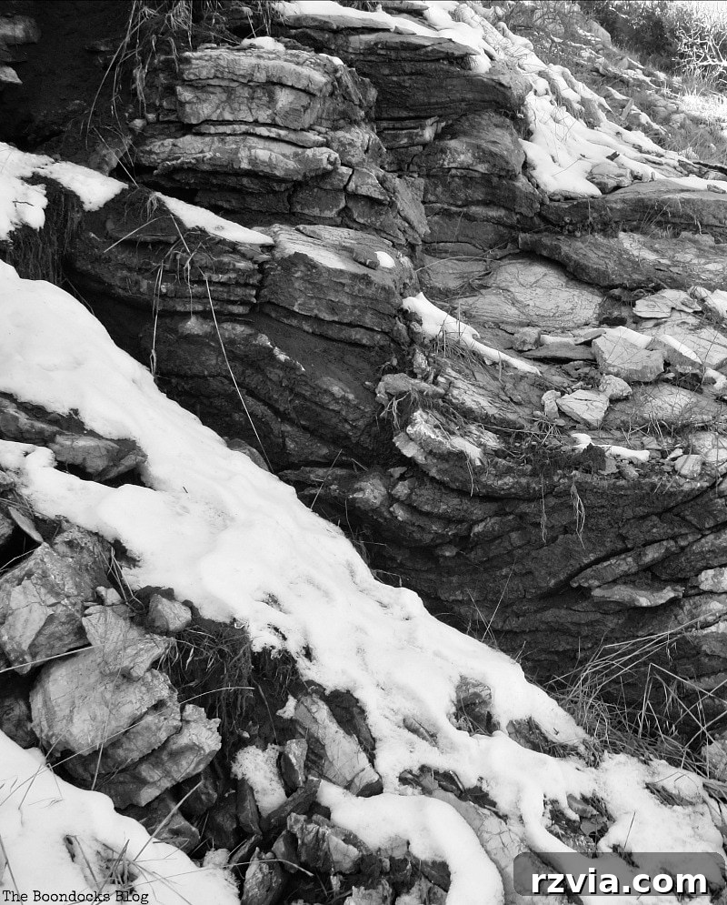 The White Crowns of Greece 19 Striking rock formations covered with pristine snow in the Greek mountains, showcasing the rugged beauty of the winter landscape.