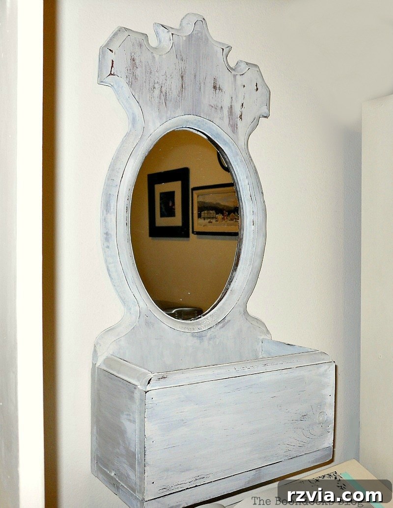 Wooden mirror with an integrated storage box, beautifully painted in OFMP Oyster White. theboondocksblog.com
