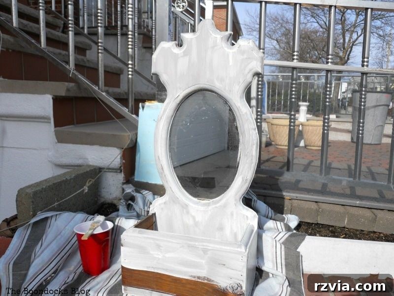 Mirror after the first thin coat of Oyster White Old Fashioned Milk Paint, showing early transformation. theboondocksblog.com