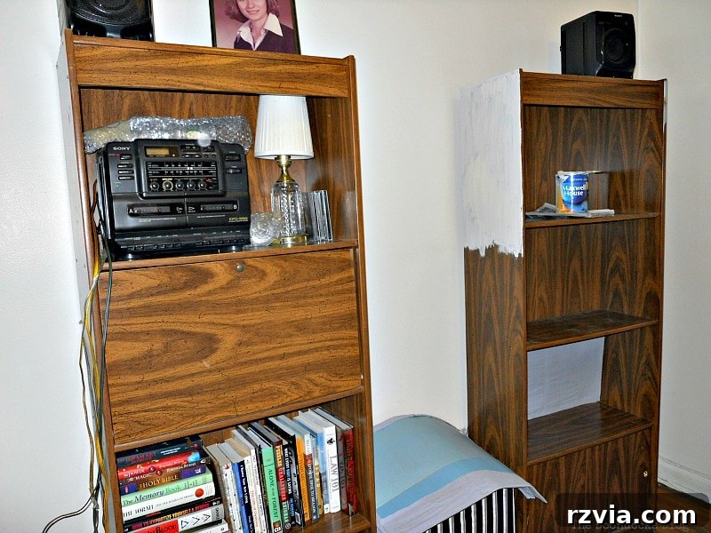Paper and Paint Power: Bookcase Transformations 4 Starting to paint the bookcase white.