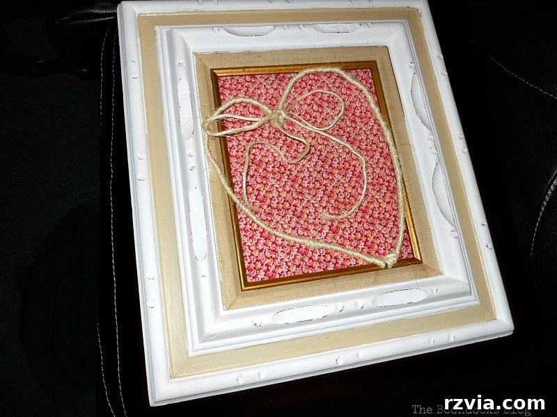 DIY Valentine Heart Frame 11 Close-up of the flowery red fabric on the wooden insert, placed inside the frame