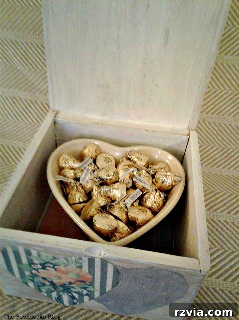 Close-up of chocolates inside the heart-shaped bowl within the wooden gift box