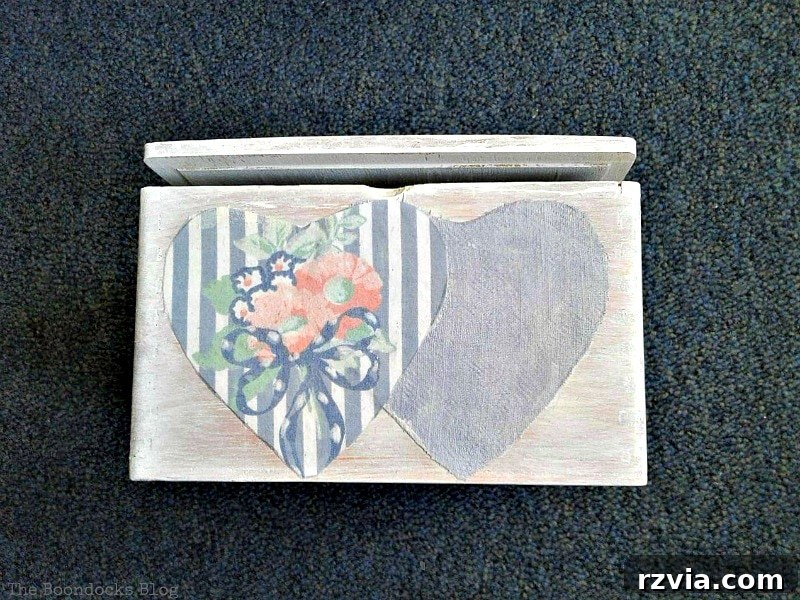 Sides of the wooden gift box adorned with decoupaged fabric hearts using Mod Podge