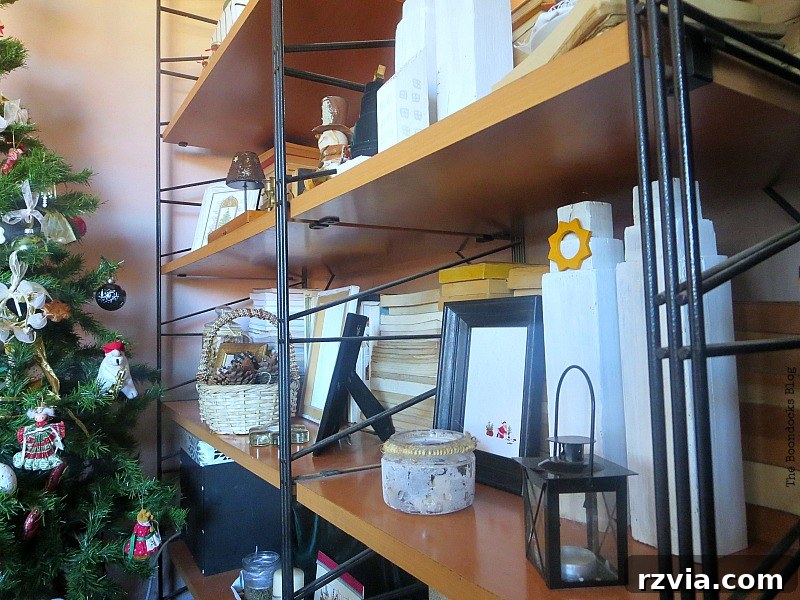 Angled view of the wall unit, highlighting the tall white repurposed wooden legs