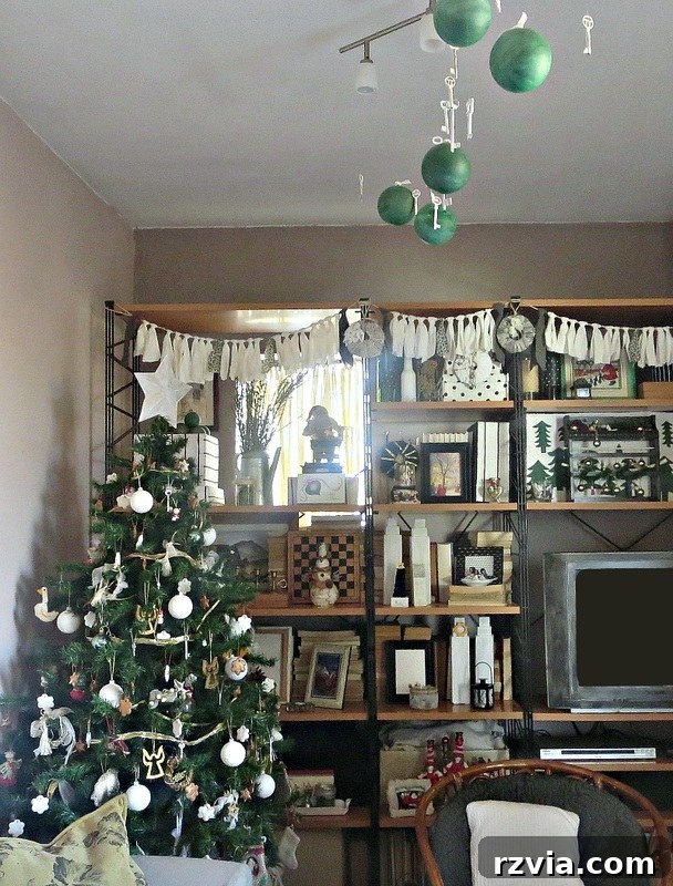 Long view of the living room and wall unit, showcasing the overall repurposed Christmas decor