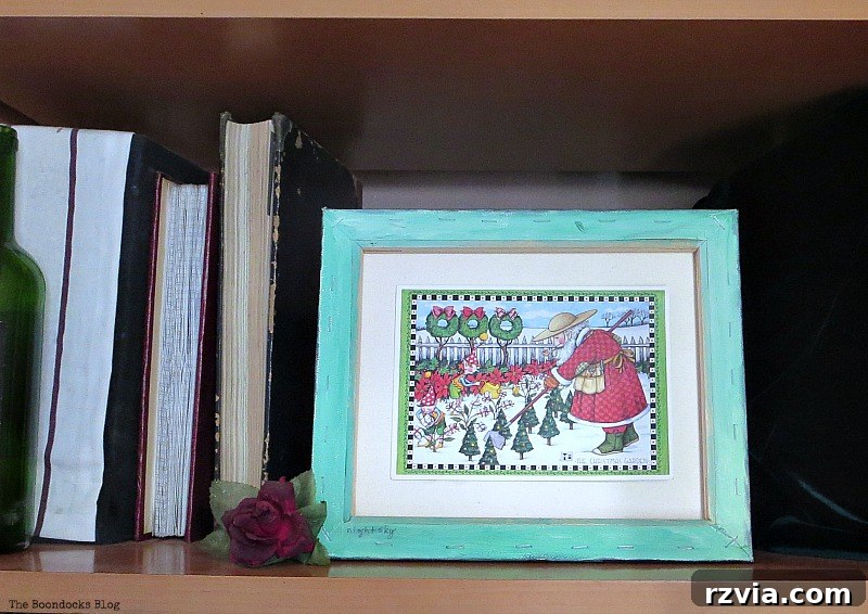 Green-framed canvas displaying a Christmas card, a clever repurposing idea
