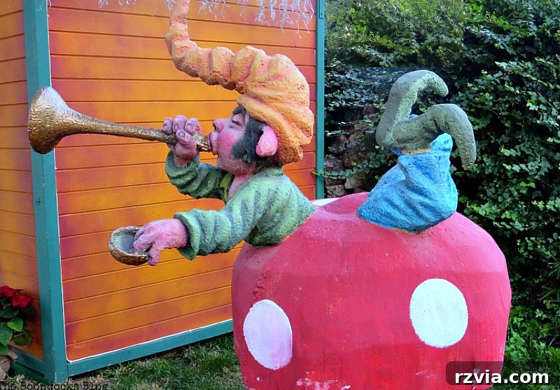 A whimsical goblin perched on a mushroom, representing the Kalikantzari