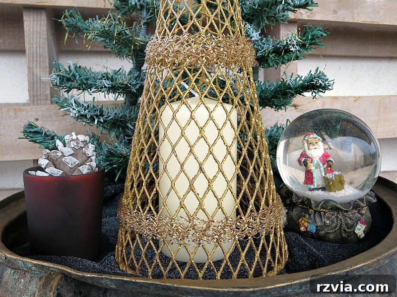 a white candle is placed under the gold tree, A repurposed Antique Cauldron for Christmas theboondocksblog
