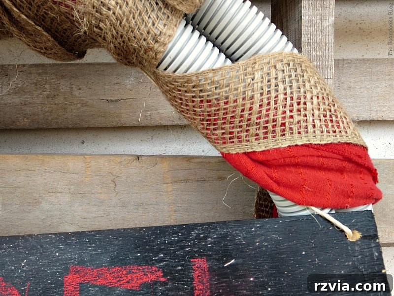 Further detail of the tube wreath showing its texture and how the burlap ribbon integrates with its design for a holiday look.