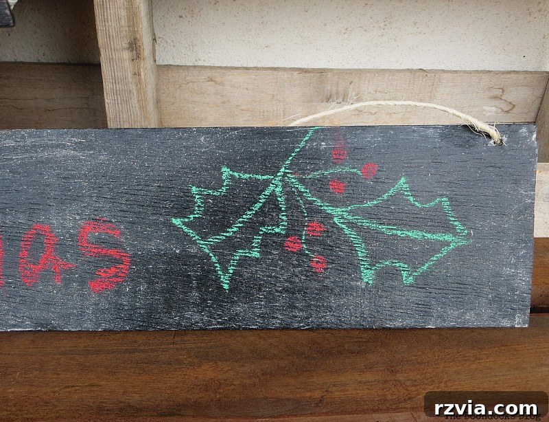 Detailed shot of the 'Merry Christmas' sign integrated into the burlap and tube wreath, creating a cohesive holiday decoration.