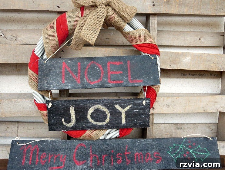 A completed chalkboard sign proudly displaying 'Merry Christmas' in festive calligraphy, ready for holiday display.