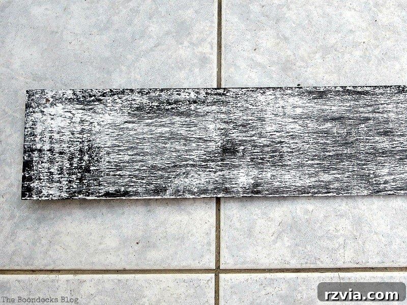 The chalkboard signs covered completely with white chalk for the curing process, sitting overnight to prepare the surface.