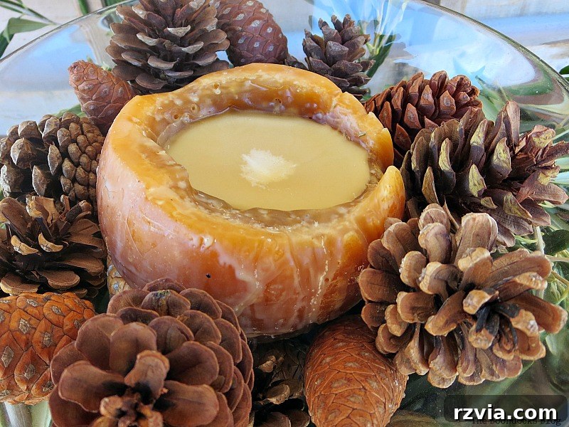 Autumn's Bounty for Your Table 13 A festive Thanksgiving centerpiece featuring a central candle surrounded by an artful arrangement of various pinecones, emanating a warm, inviting glow.