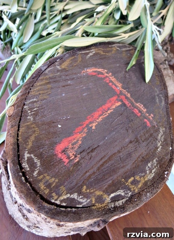 Autumn's Bounty for Your Table 17 The rustic wood stump centerpiece base, enhanced with a hand-chalked 'T' to signify Thanksgiving, ready for final adornments.