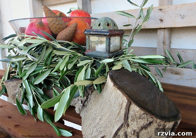 Autumn's Bounty for Your Table 10 Side view of the glass bowl centerpiece, featuring pomegranates and pinecones, set alongside the rustic wood stump base.