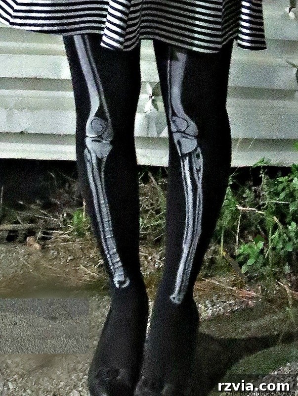 Creepy skeleton legs peeking out, adding to the unsettling atmosphere of the Halloween party, www.theboondocksblog.com