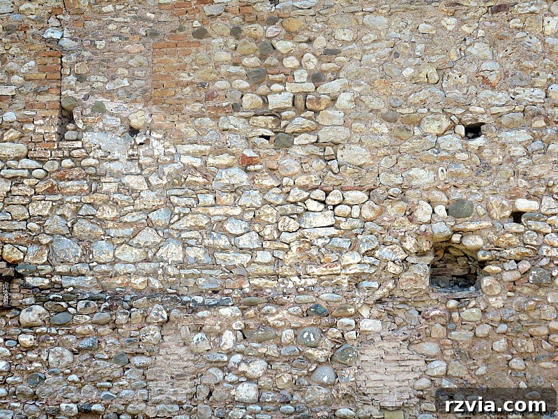 Stone Chronicles of the Shore 13 Close-up of a textured stone wall, showcasing the inherent beauty and craftsmanship of ancient stone buildings on the waterfront. Image by www.theboondocksblog.com