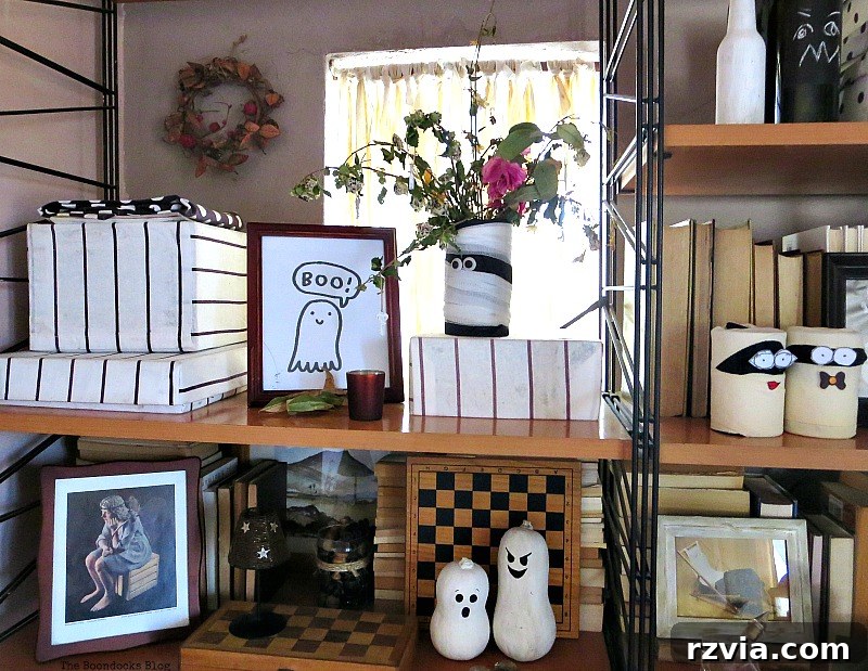 A framed 'boo' sign alongside Mr. Bandages with dried flowers, part of the Halloween Wall Unit Decor.