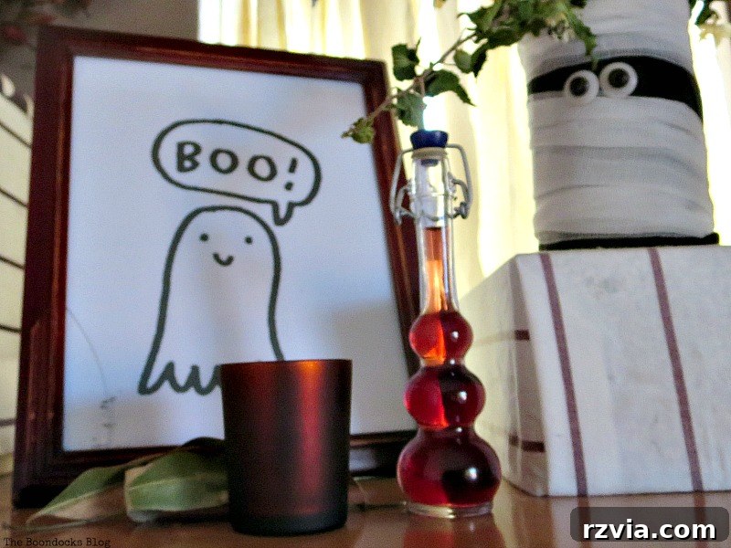 Red accents on the shelf, featuring an unusual bottle and tealight in the Halloween Wall Unit Decor.
