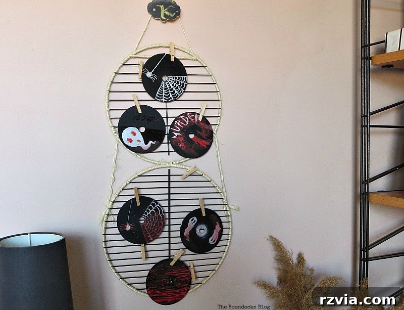 Photo display made with grill parts, cleverly repurposed for Halloween Wall Unit Decor.