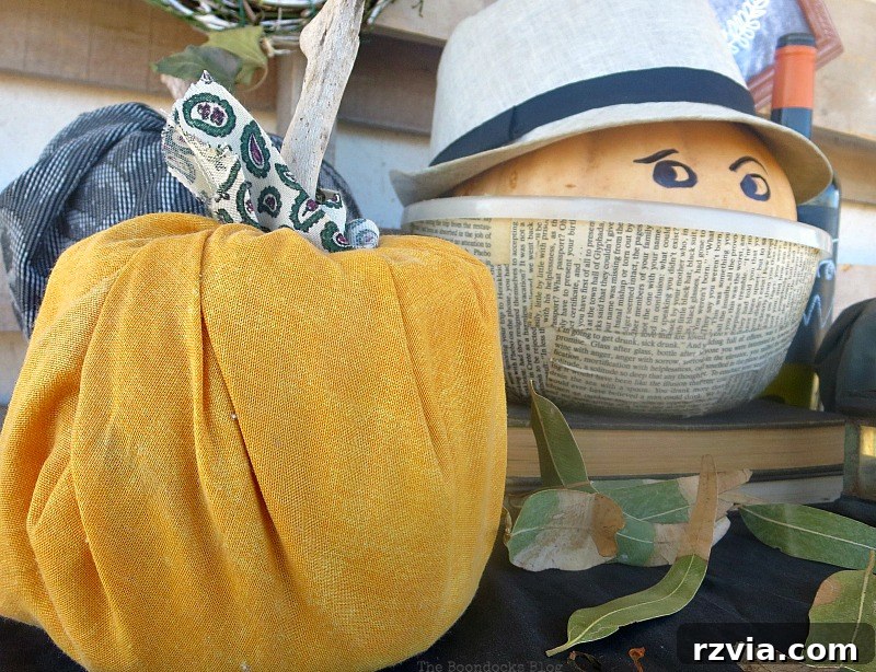 Crafting the Paranoid Pumpkin Man 5 The Paranoid Man Pumpkin next to a display of orange and black pumpkins, highlighting his feeling of being overshadowed in 'The Paranoid Man Pumpkin Craft,' from www.theboondocksblog.com
