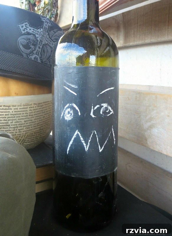 Crafting the Paranoid Pumpkin Man 7 A chalkboard bottle with a distinct expression, shown next to 'The Paranoid Man Pumpkin,' from www.theboondocksblog.com