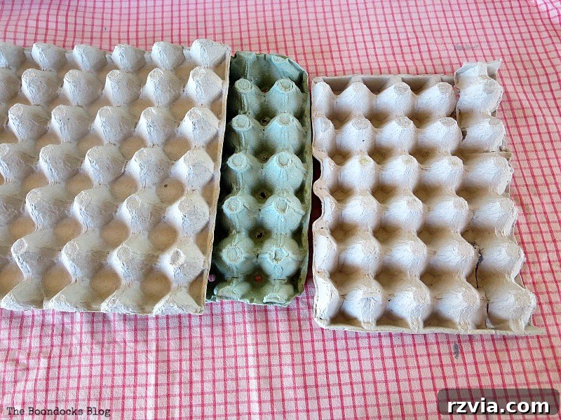 Collection of prepared egg carton flower shapes, ready for painting, demonstrating the core material for crafting DIY fall flowers from repurposed egg cartons.