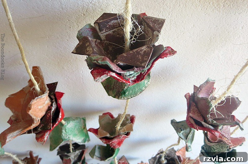 Another perspective of the charming egg carton flower vine hanging as unique wall art, emphasizing its handcrafted appeal.