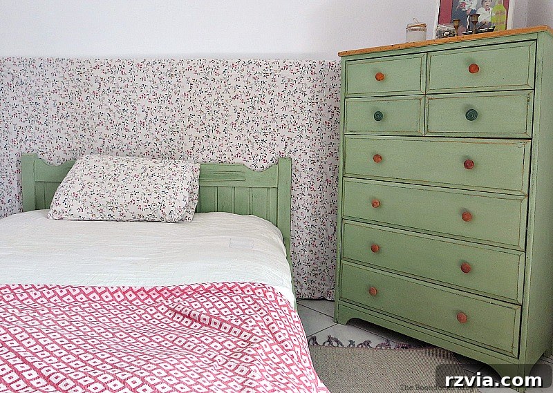 The finished distressed green bed frame displayed next to the matching dresser, creating a cohesive and charming bedroom set.