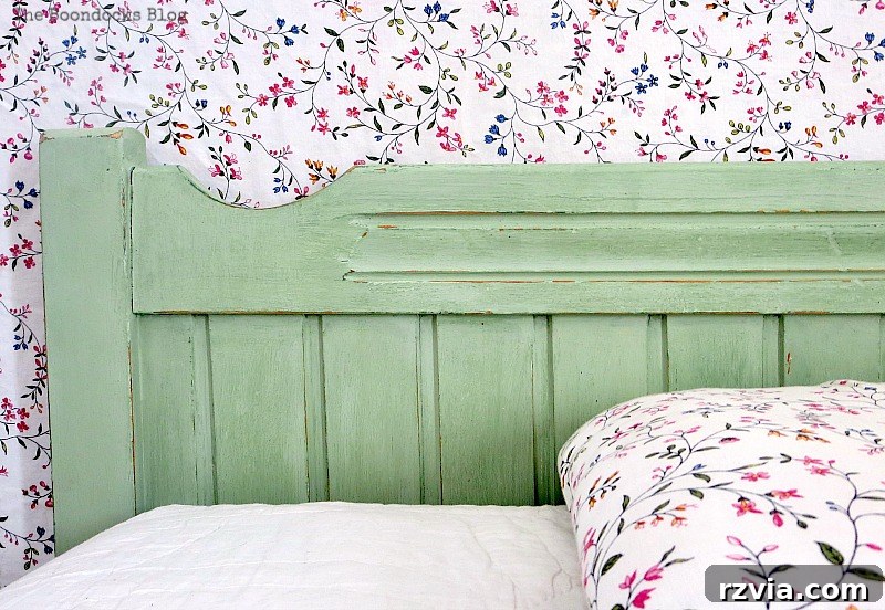 View of the left side of the headboard, showcasing the subtle distressing and the layered green paint effect.