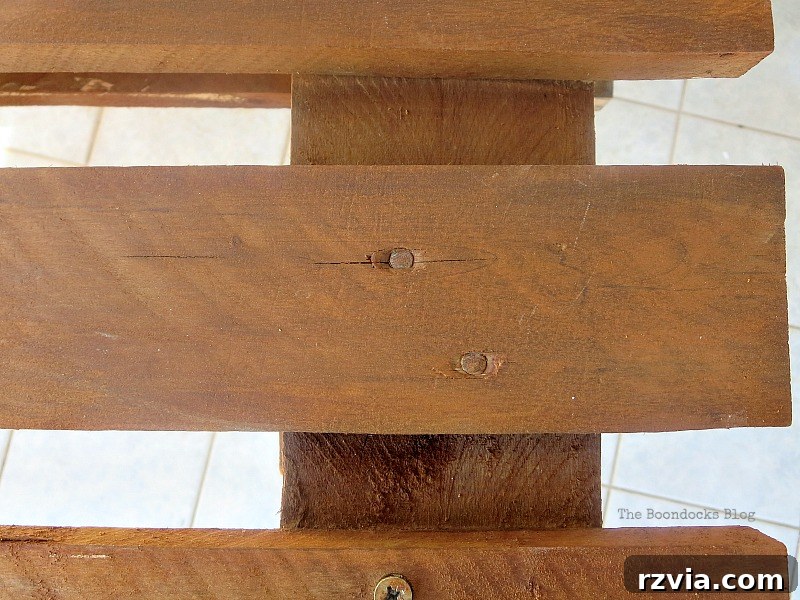 Upcycled Elegance: Crafting a Pallet and Salvaged Wood Table 11 The deep, earthy tones of the pallet wood after three coats of the natural vinegar and rust stain, showcasing the rich, rustic finish. www.theboondocksblog.com