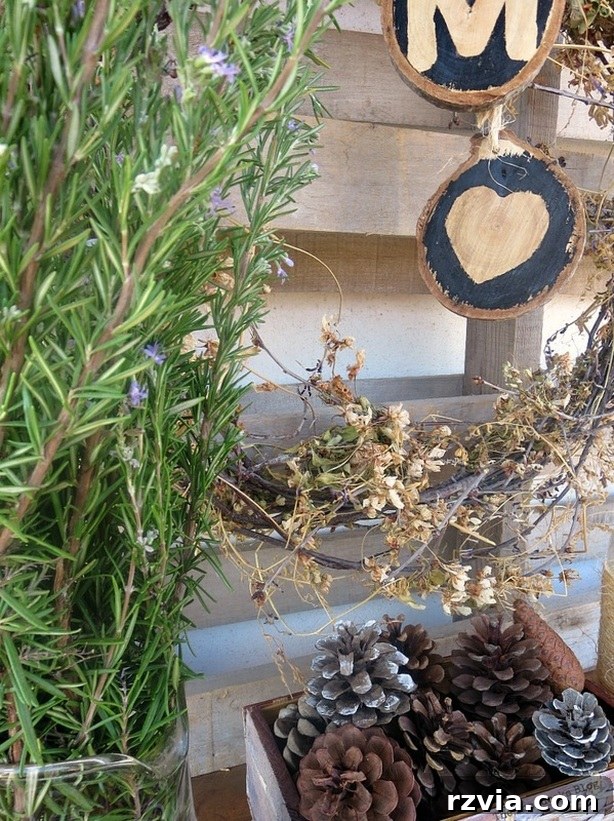 Upcycled Elegance: Crafting a Pallet and Salvaged Wood Table 20 Detailed view of the elements within the fall vignette, showcasing the curated rustic decor against the upcycled pallet table and backdrop. www.theboondocksblog.com