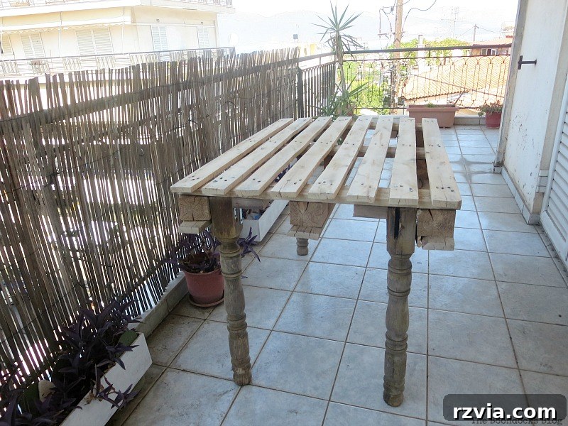 Upcycled Elegance: Crafting a Pallet and Salvaged Wood Table 7 The DIY pallet table finally standing straight and stable after reinforcing the leg attachments, no longer living up to its 'drunken' nickname. www.theboondocksblog.com
