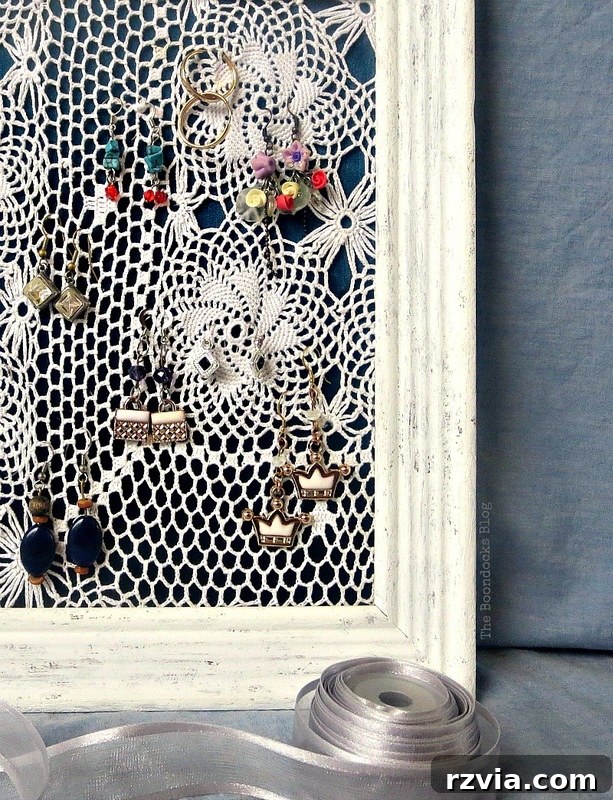DIY Earring Storage Made Simple 13 A detailed shot of various earrings organized and hanging on the elegant DIY earring holder.