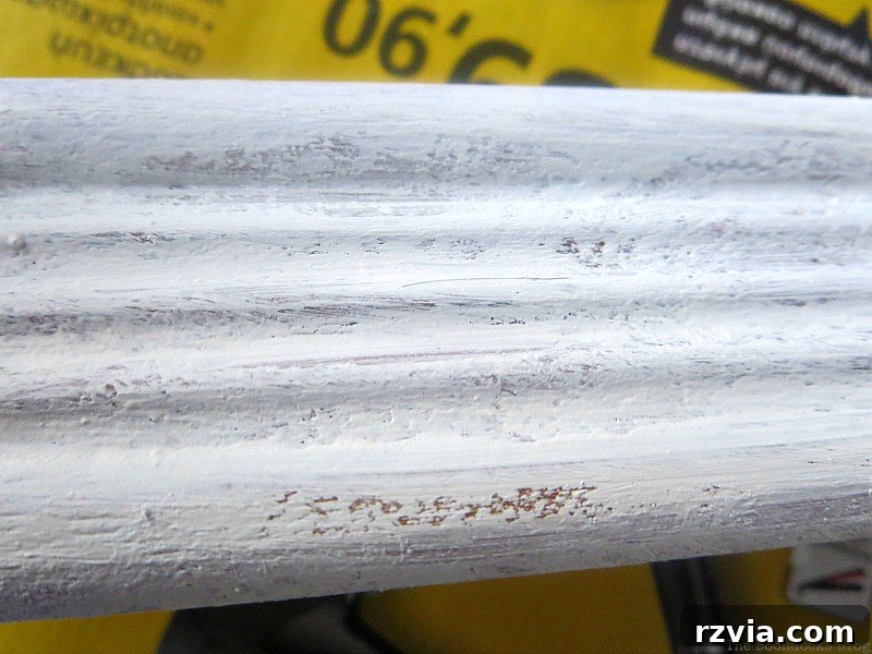 DIY Earring Storage Made Simple 5 A close-up view of the wood frame after being painted white, showing off its new textured finish.