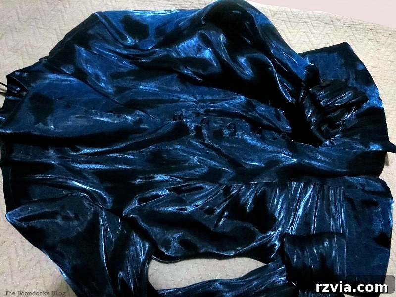 DIY Earring Storage Made Simple 6 A vibrant blue satin blouse, ready to be repurposed for the earring organizer project.