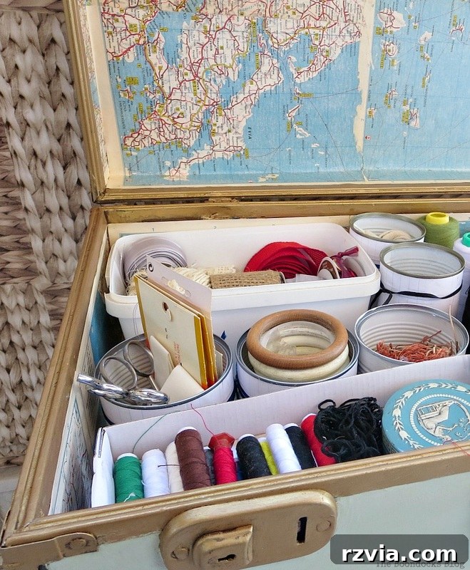 What Stories Does the Vintage Suitcase Tell 15 Decorated tin cans repurposed for organizing sewing supplies in the vintage suitcase