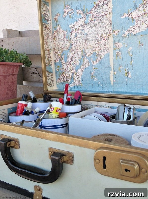 What Stories Does the Vintage Suitcase Tell 17 Vintage suitcase fully organized with sewing supplies and decoupaged with maps