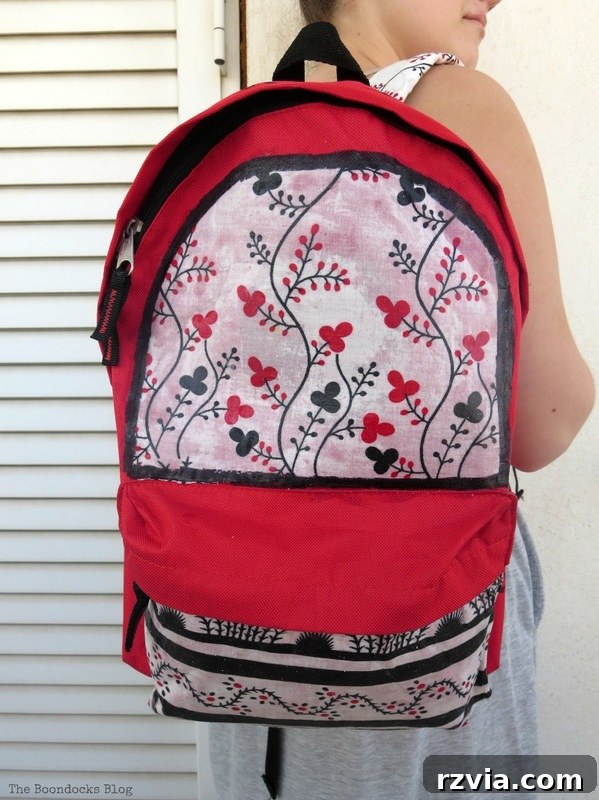 From Fabric Scraps to Adventure Packs 2 A stylish, custom-made backpack with floral fabric accents, ready for school.