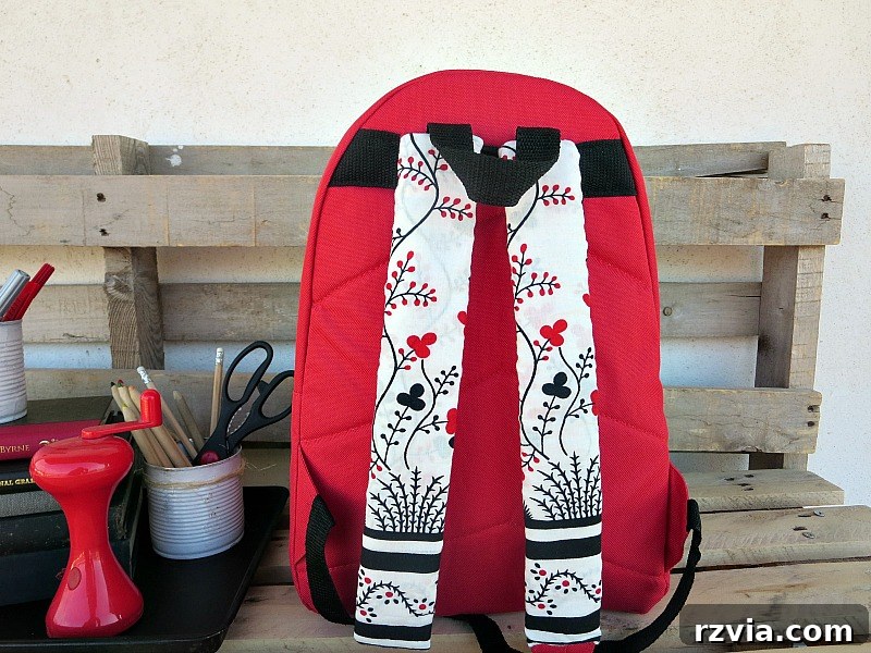 From Fabric Scraps to Adventure Packs 16 Close-up view of the pretty fabric-covered straps on the DIY backpack.