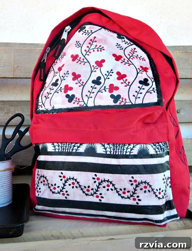 From Fabric Scraps to Adventure Packs 24 Completed DIY backpack makeover with upcycled clothing, showcasing the beautiful transformation.