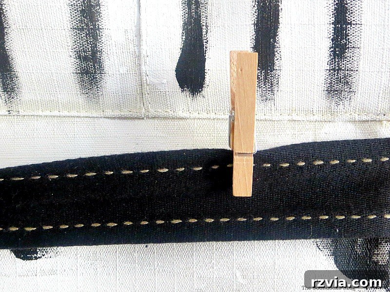 Mini Clothespins Attached to Ribbons on the Hanging Organizer for Display