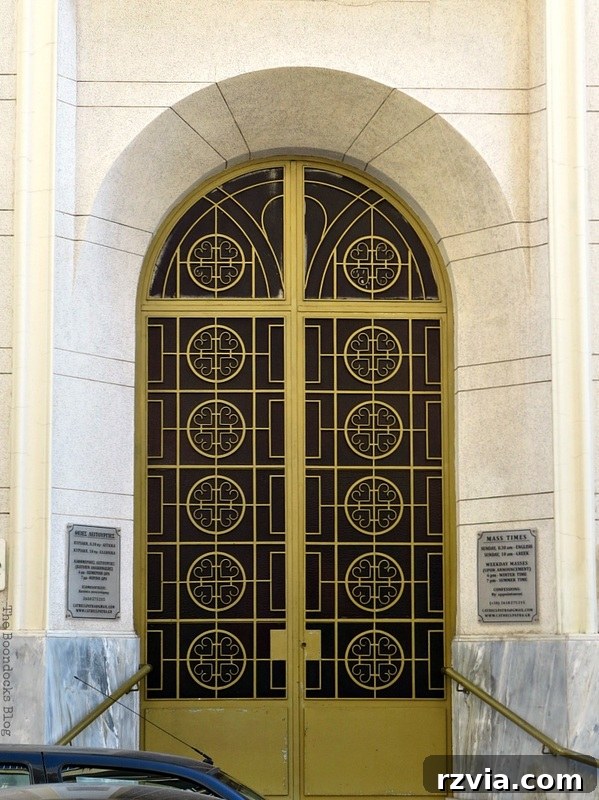 Distinctive mustard-colored metal church door, adding a unique color accent to Greek religious buildings, from www.theboondocksblog.com.