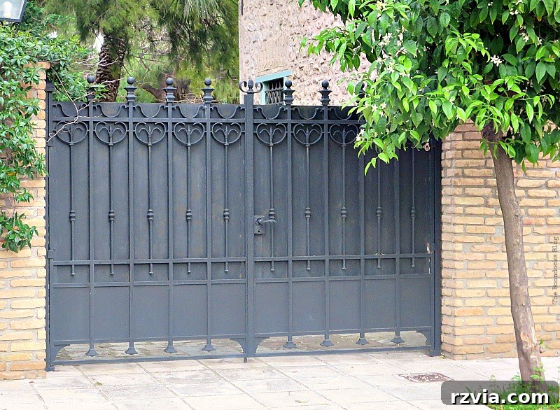 Sturdy metal gate, providing security and architectural interest in a Greek urban or rural landscape, from www.theboondocksblog.com.