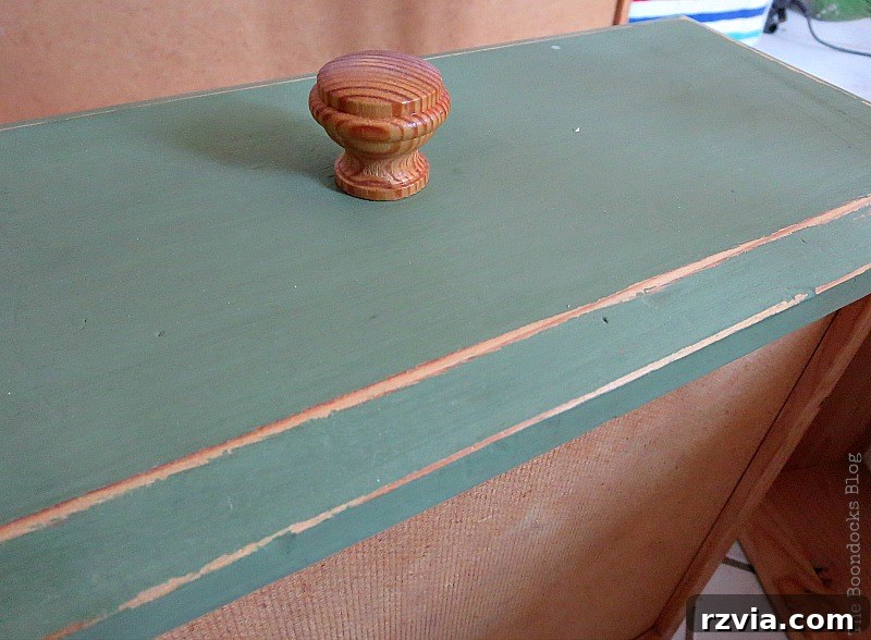 Ikea Pine Dresser Makeover 7 Distressing a drawer on the IKEA pine dresser to reveal the wood underneath the dark green paint. How to save an Ikea Pine Dresser www.theboondocksblog.com
