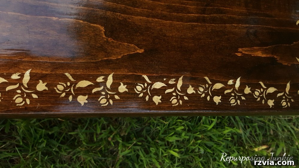 From Curb to Chic: Coffee Table's Gorgeous New Look 9 Sealing the finished coffee table with polyurethane, ensuring durability and a beautiful, lasting finish.