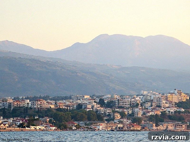 A closer view of the charming coastal town from the sea during sunset