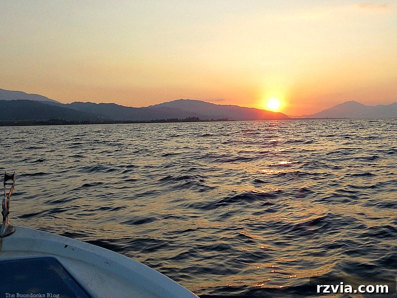 Our boat gently cruising as the sun makes its final descent